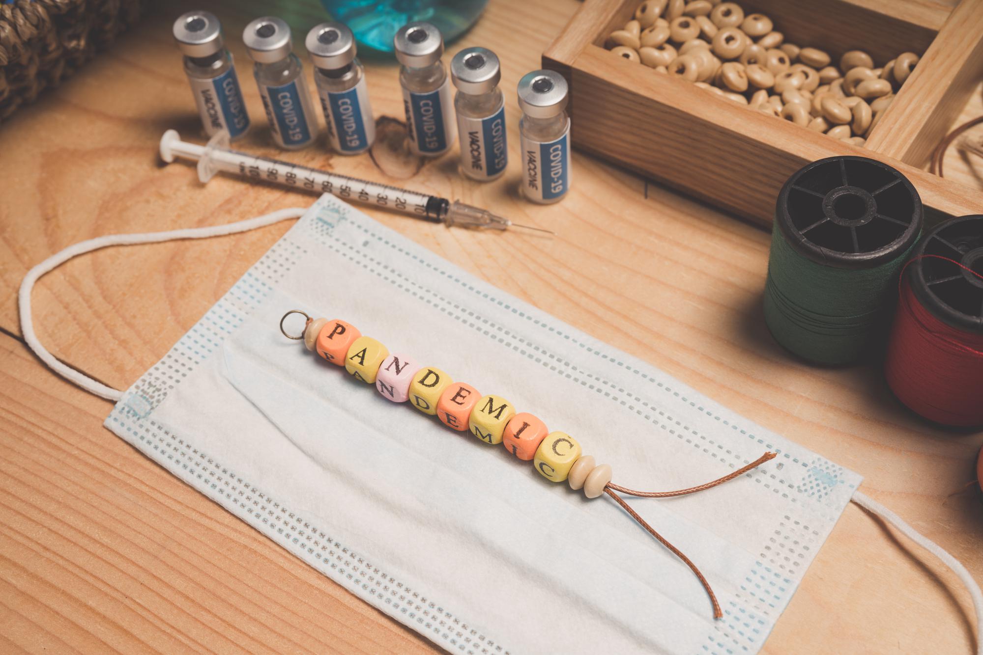 Hands finishing embroidered label in studio